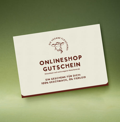 Onlineshop-Gutschein der Veganen Fleischerei mit Kuh-Logo: „Ein Geschenk für dich: 100 % Geschmack, 0 % Tierleid“